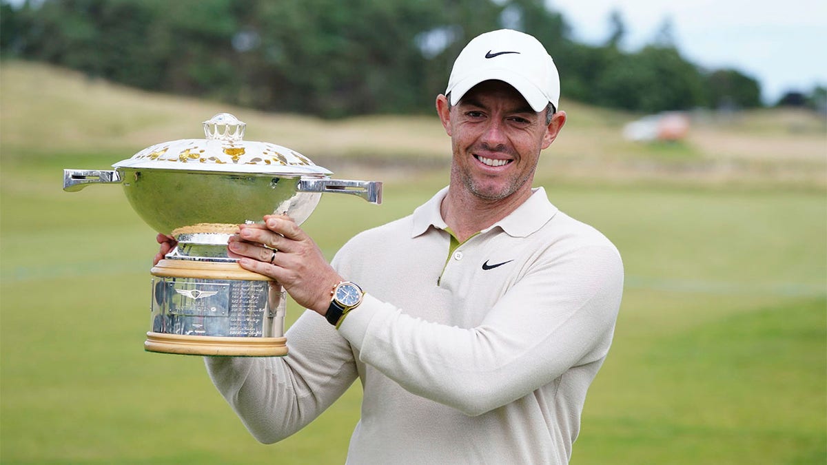 Rory McIlroy lifts trophy