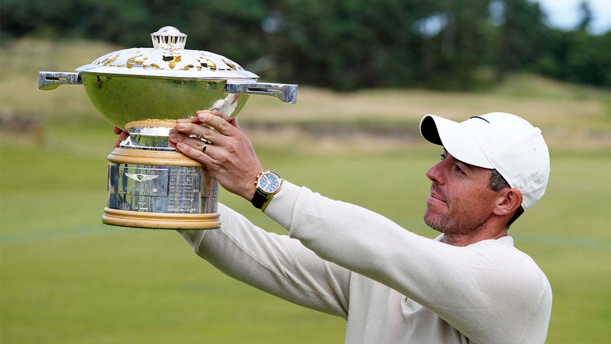 Rory McIlroy lifts trophy