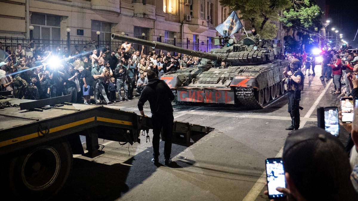 Members of Wagner group prepare to pull out from the headquarters of the Southern Military District