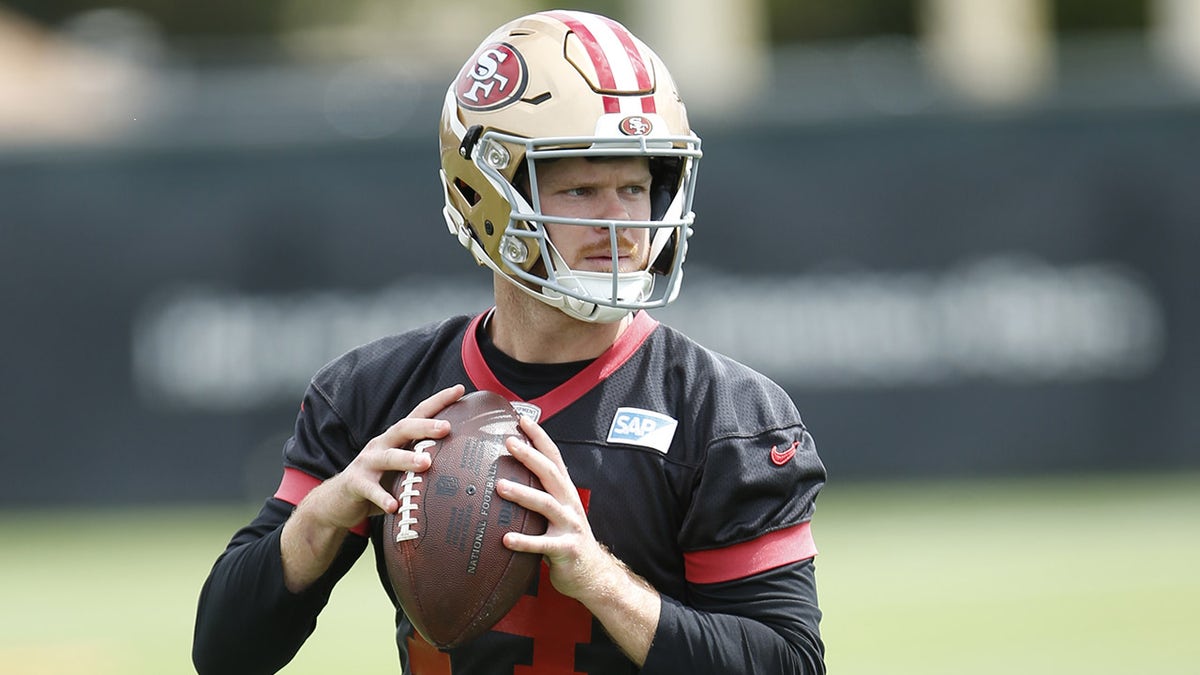 Sam Darnold looks down field