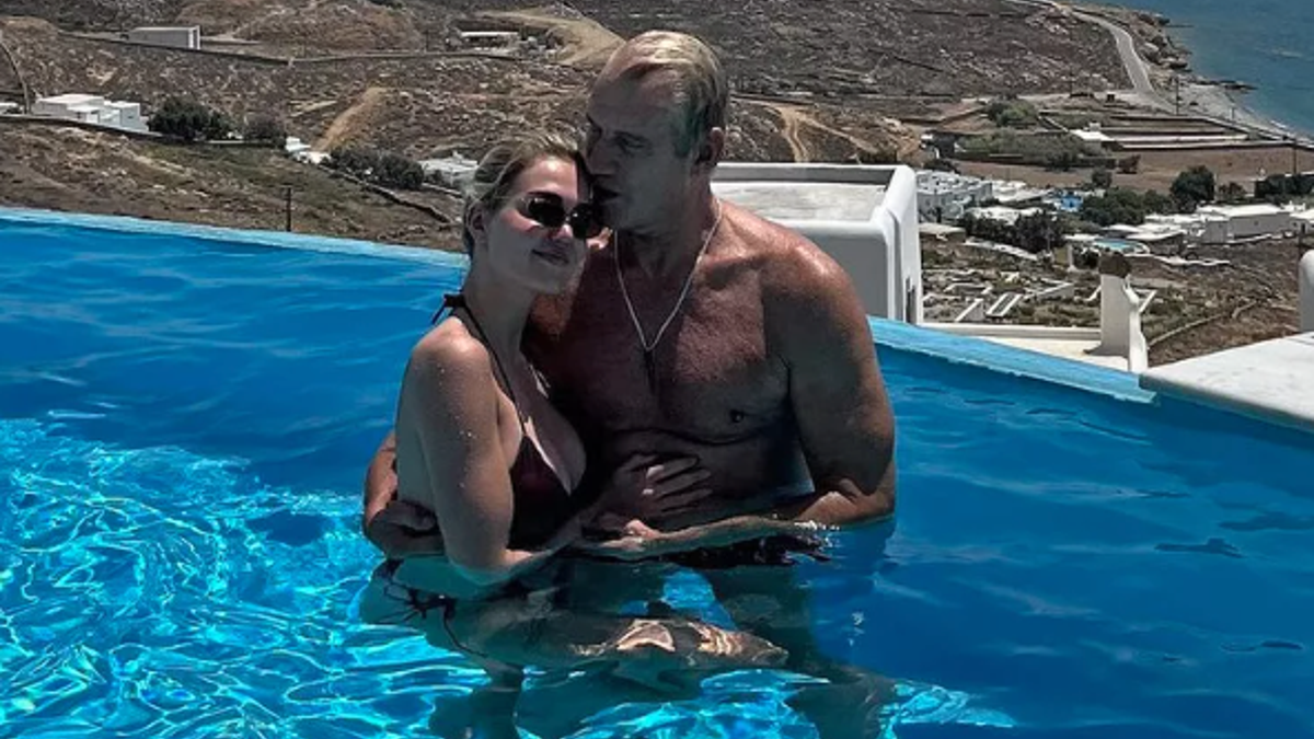 Dolph Lundgren and Emma in a pool