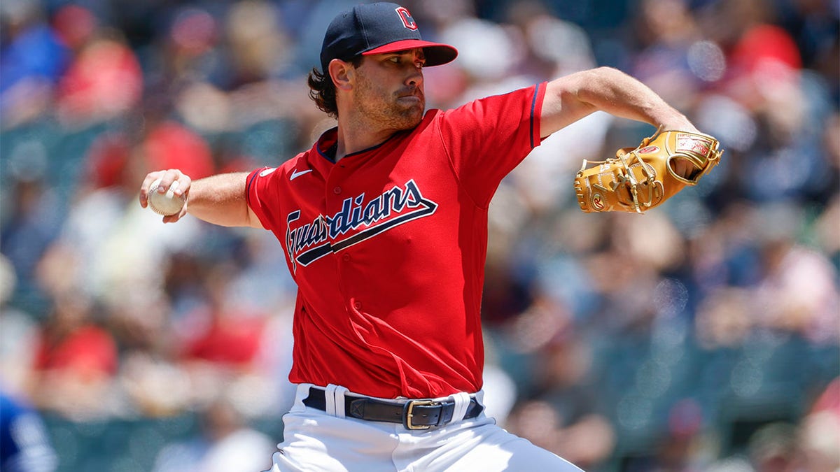 Shane Bieber throws pitch