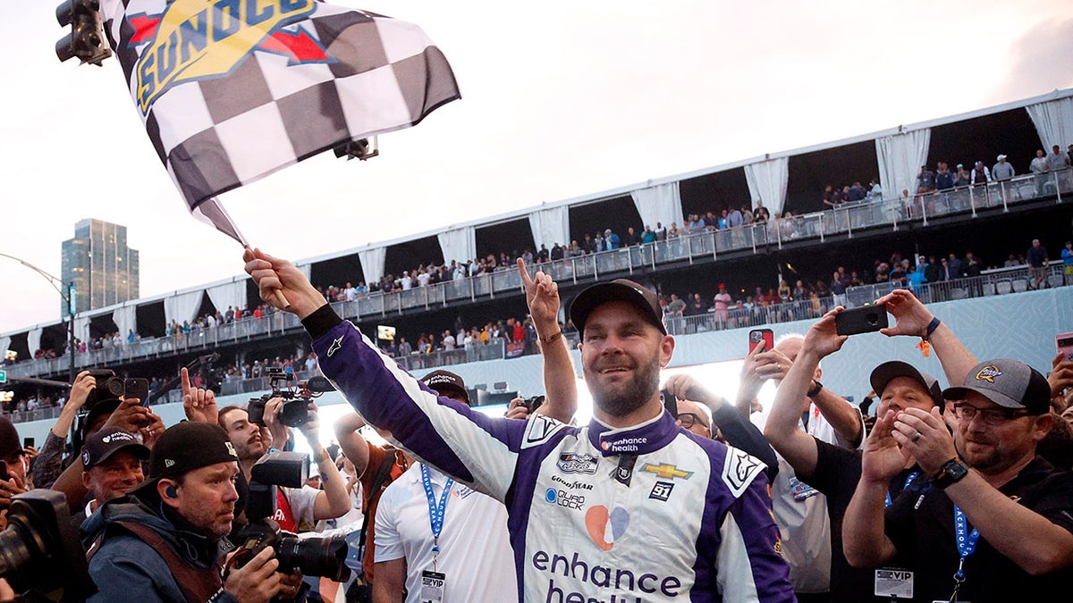 Shane Van Gisbergen waves the flag