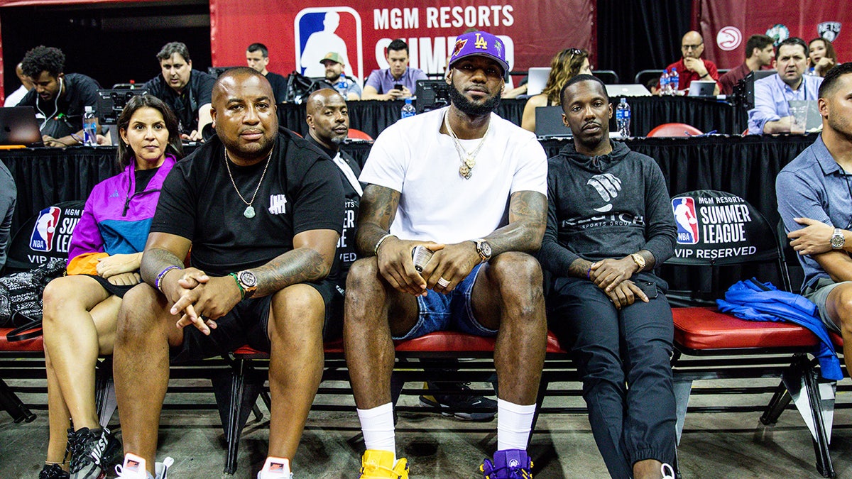 LeBron James and Rich Paul sit court side