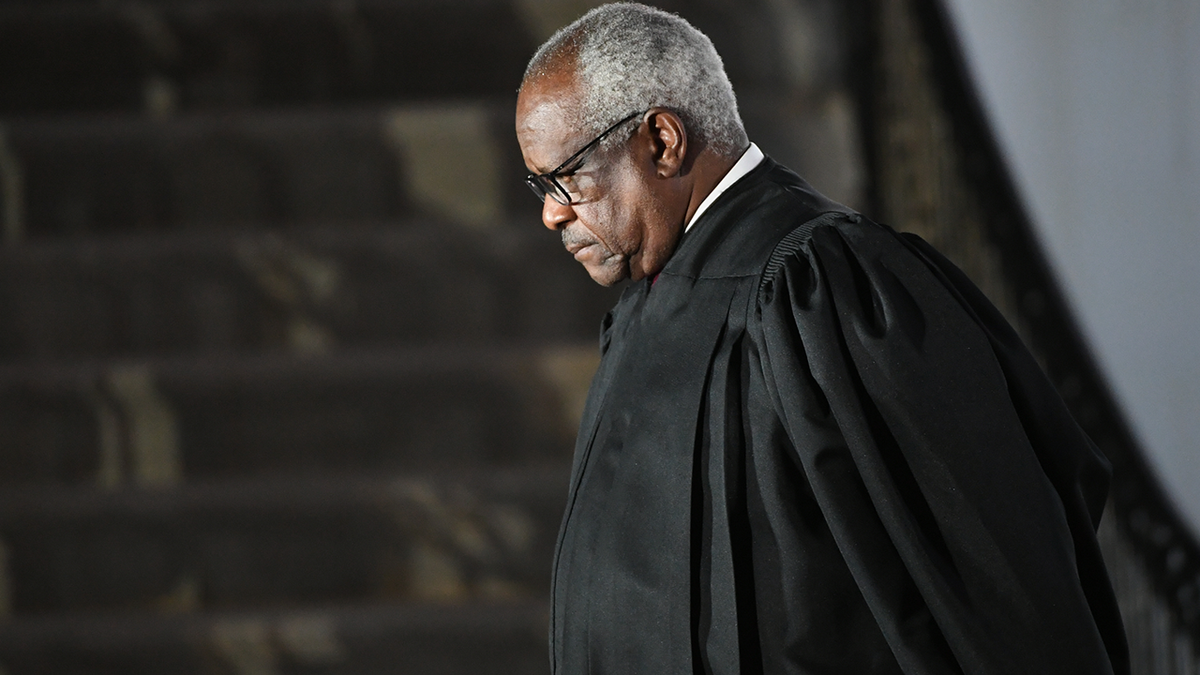 Justice Thomas in black judicial robes