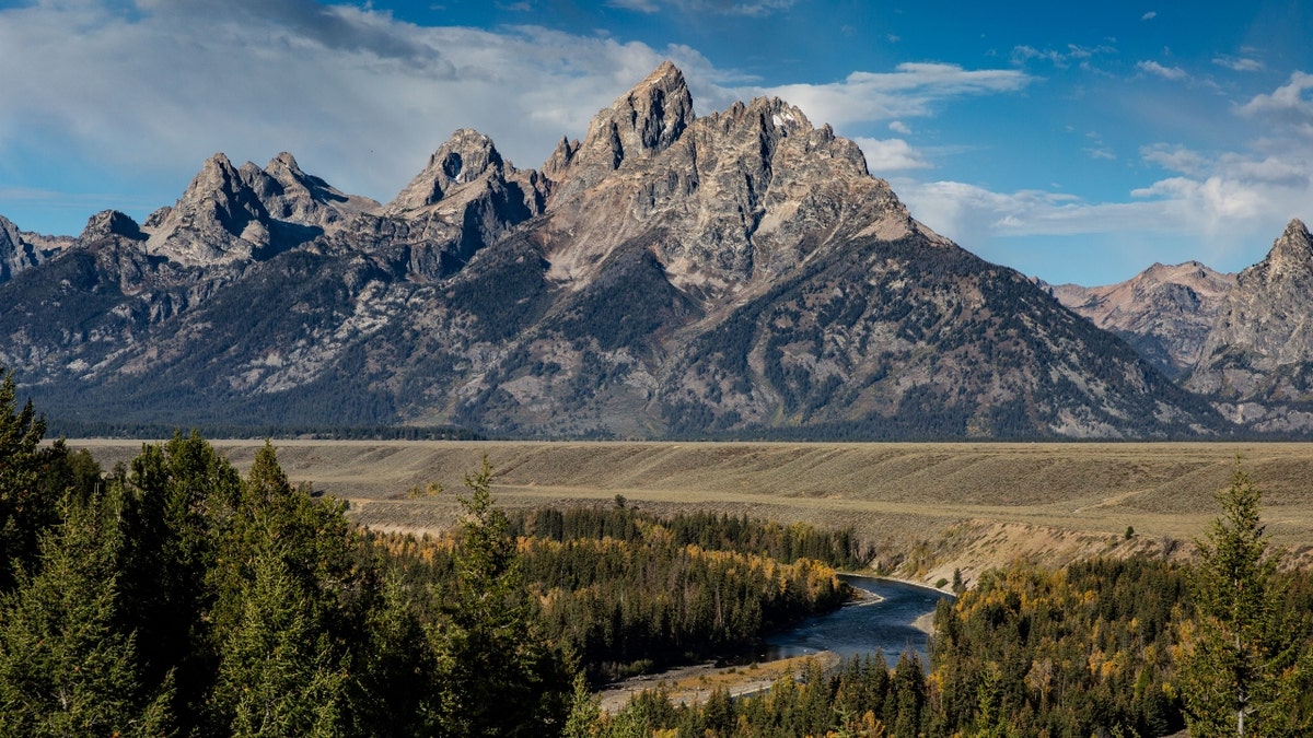 The Grand Teton Mountain Range is viewed from the Snake River Overlook