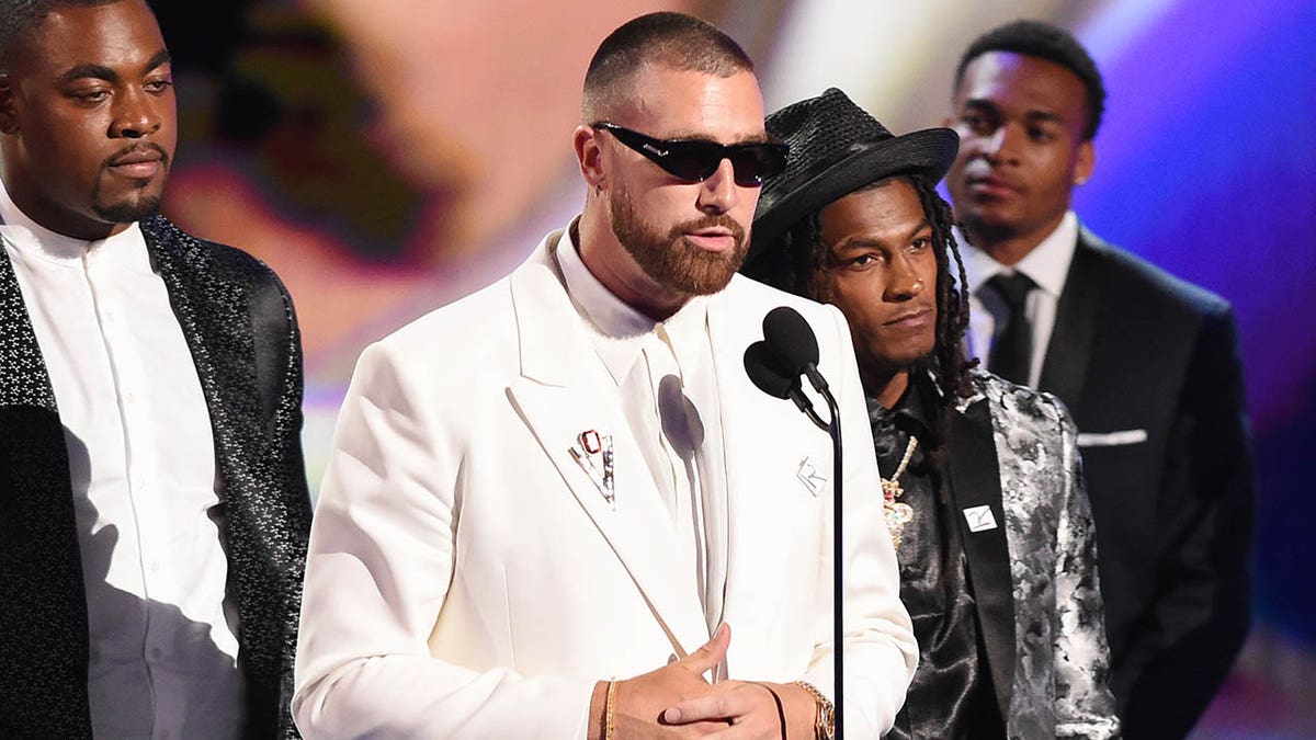 Travis Kelce accepts an award at the ESPYs