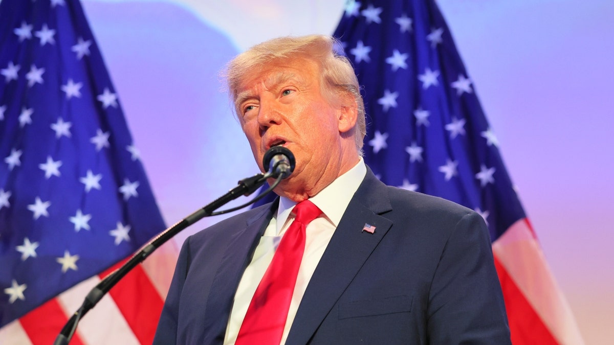 Donald Trump at a mic