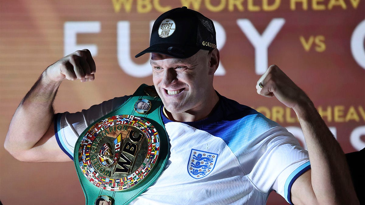 Tyson Fury poses with belt