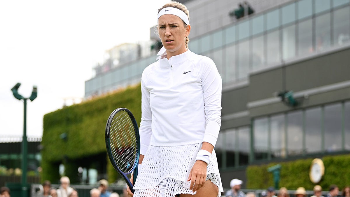 Victoria Azarenka looks on