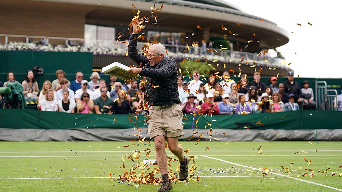 A protester throwing confetti