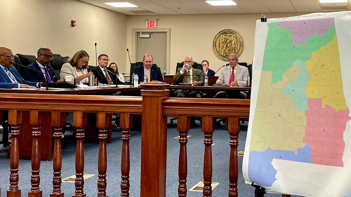 Alabama Senate committee sitting near Congressional map