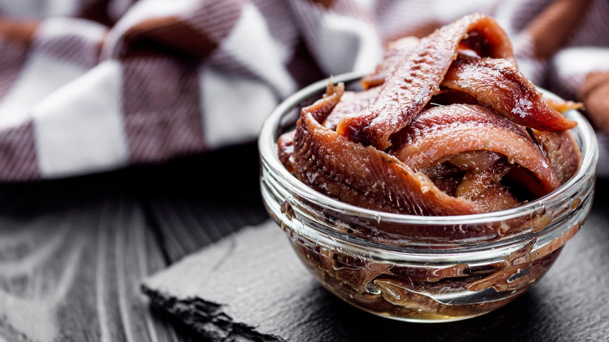 canned anchovy fillet in glass bowl