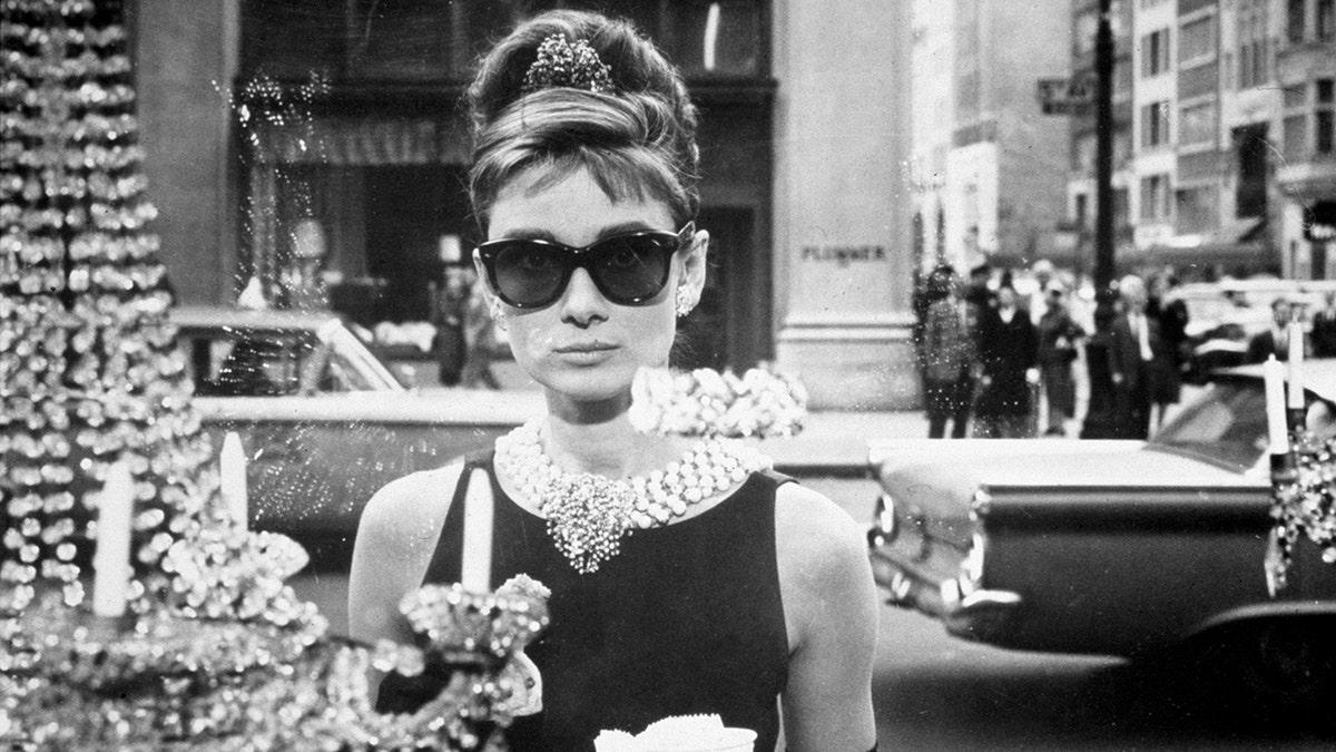 Black and white photo of Audrey Hepburn as Holly Golightly in "Breakfast at Tiffany's"