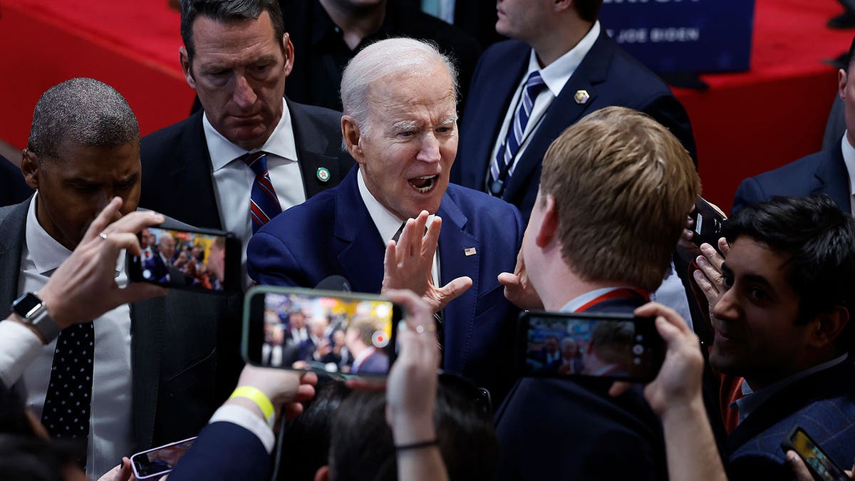 Joe Biden in a pool of reporters