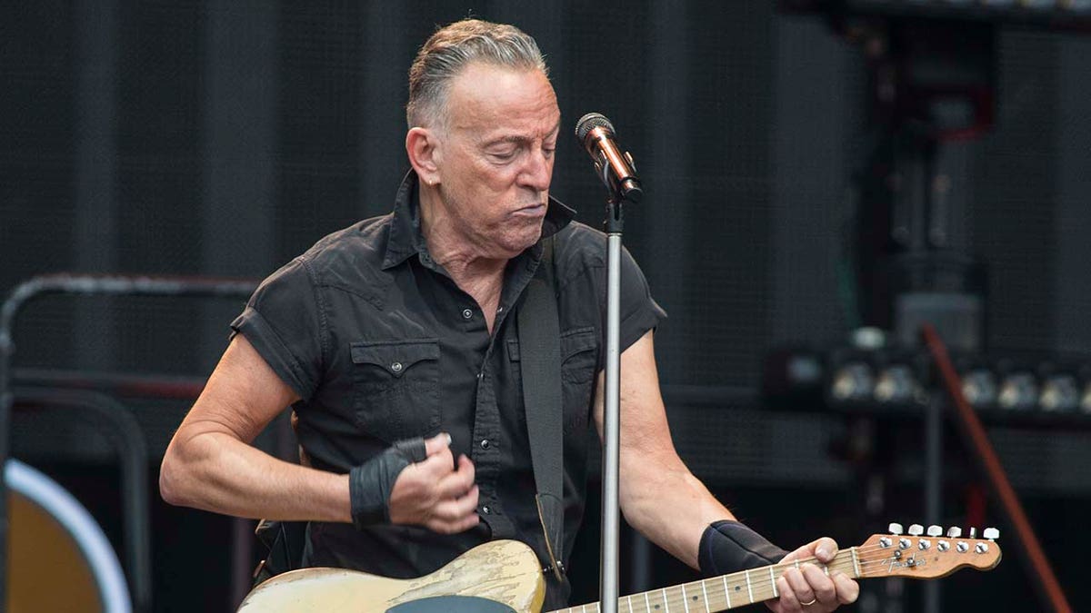 Bruce Springsteen playing the guitar