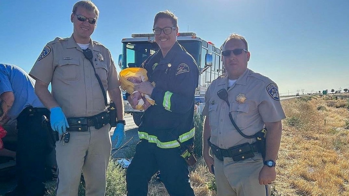 First responders holding baby girl