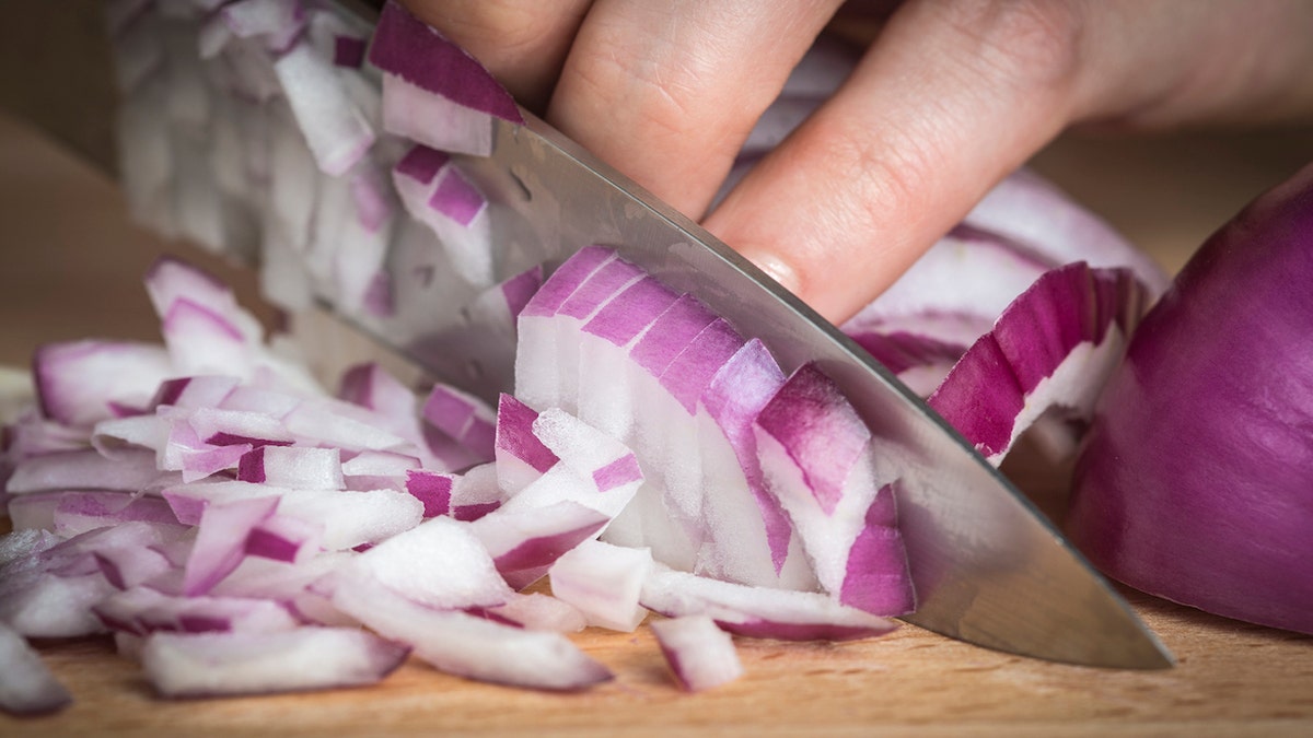 red onions chopped on board