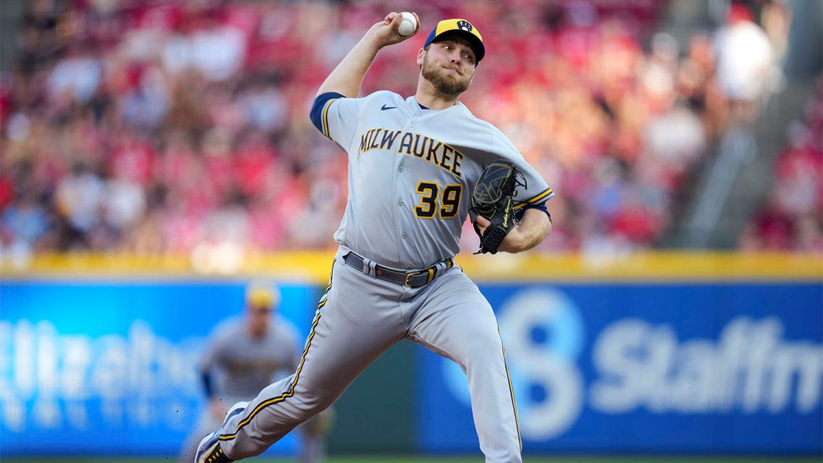 Corbin Burnes pitches against the Reds