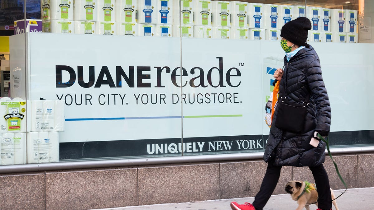 woman walking past duane reade