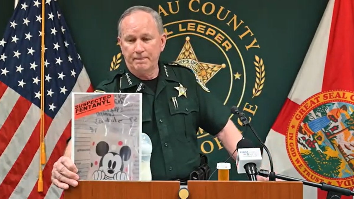 Sheriff Bill Leeper with evidence photo at press conference