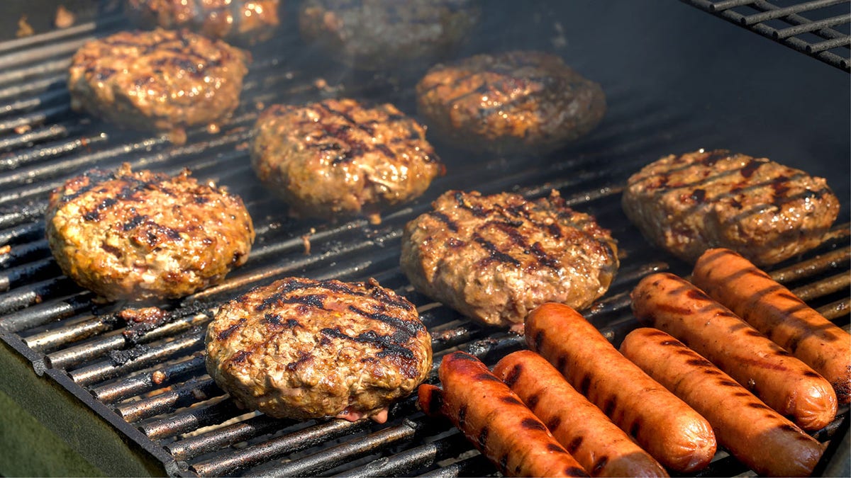 hamburgers and hot dogs on the grill