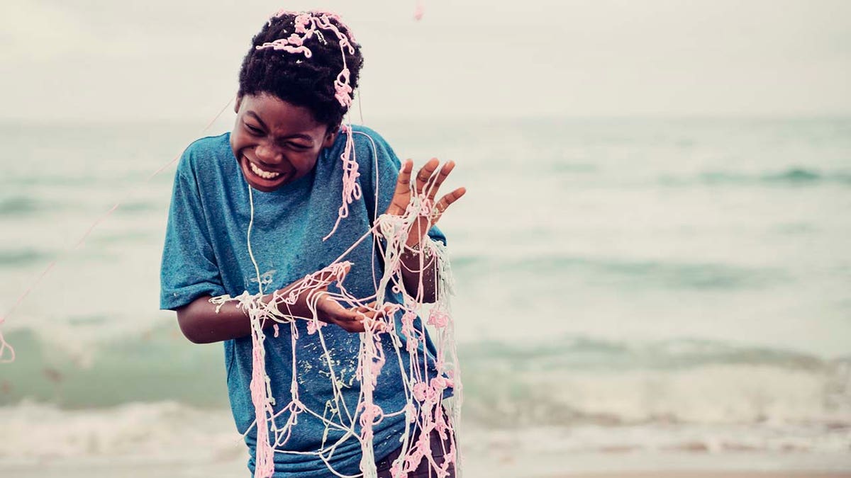 Kid covered in Silly String