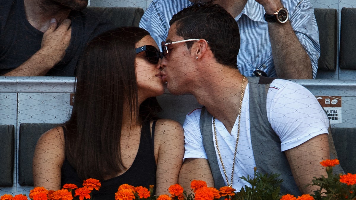 Cristiano Ronaldo and Irina Shayk kiss in Spain while watching tennis