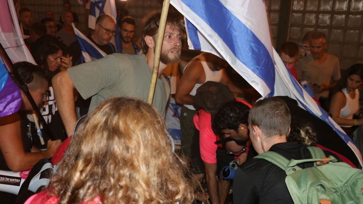 Man waving Israeli flag
