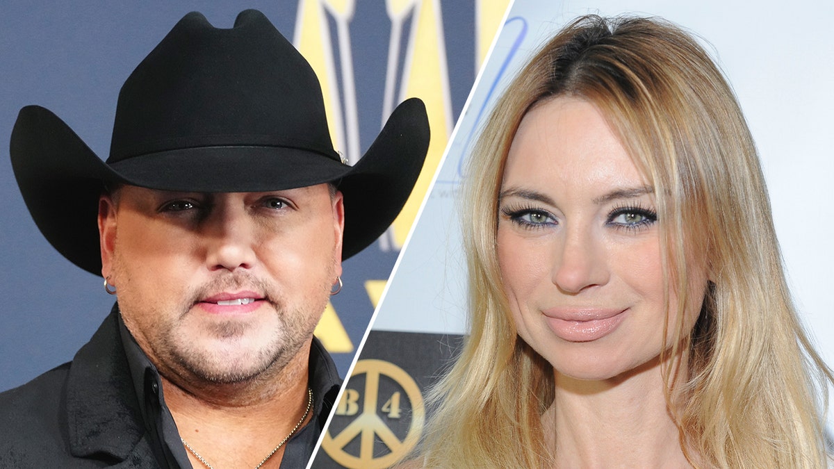 Jason Aldean in a black country hat split Izabella St. James smiles at the camera
