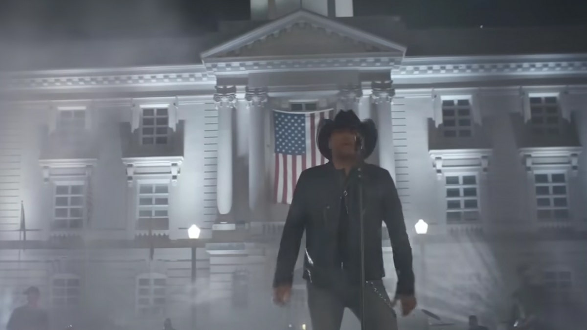 Jason Aldean sings in front of the Maury County courthouse with an American flag in his music video for "Try That In A Small Town"