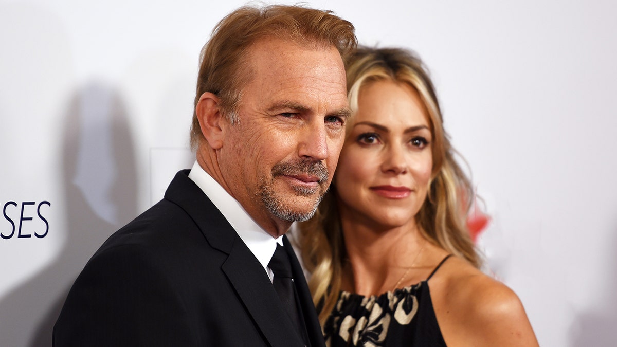 Kevin Costner and Christine Baumgartner attend red carpet event