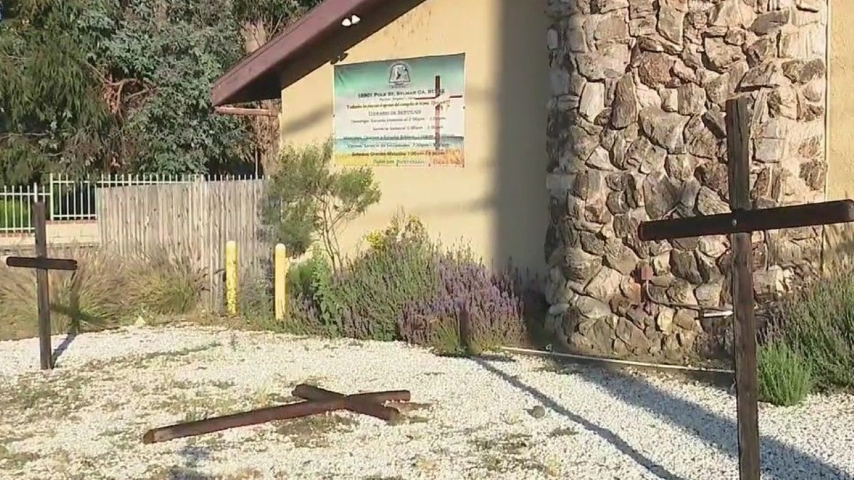 Burned crosses outside church