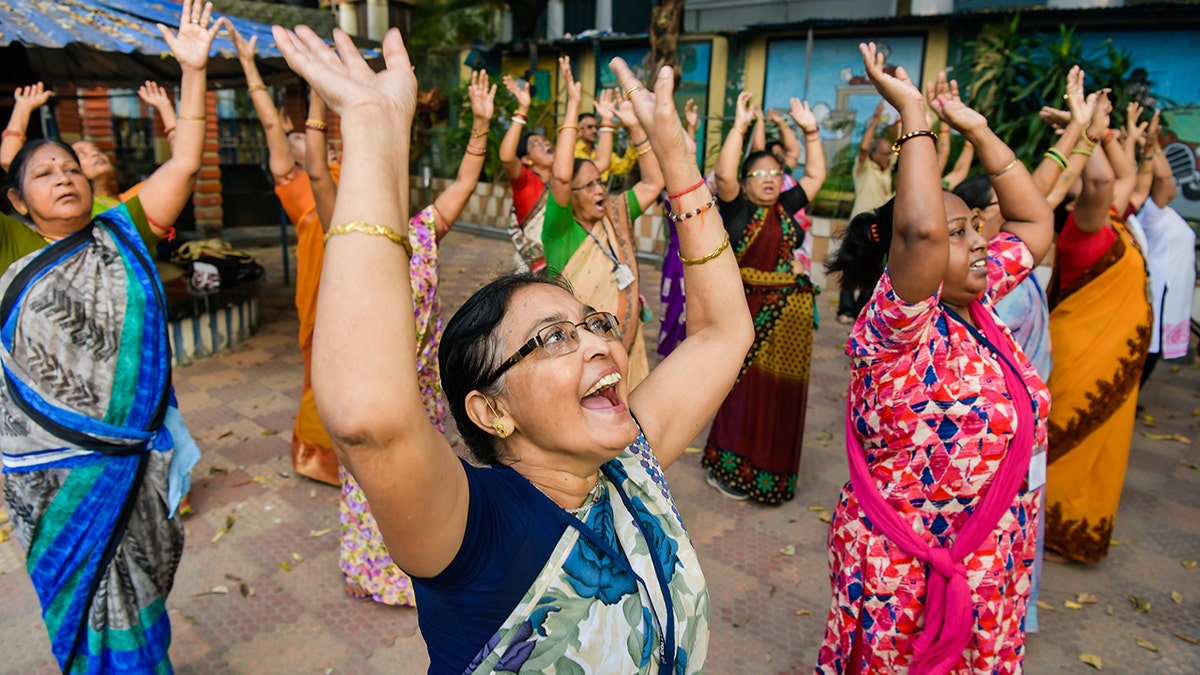 A group of people doing laughter yoga