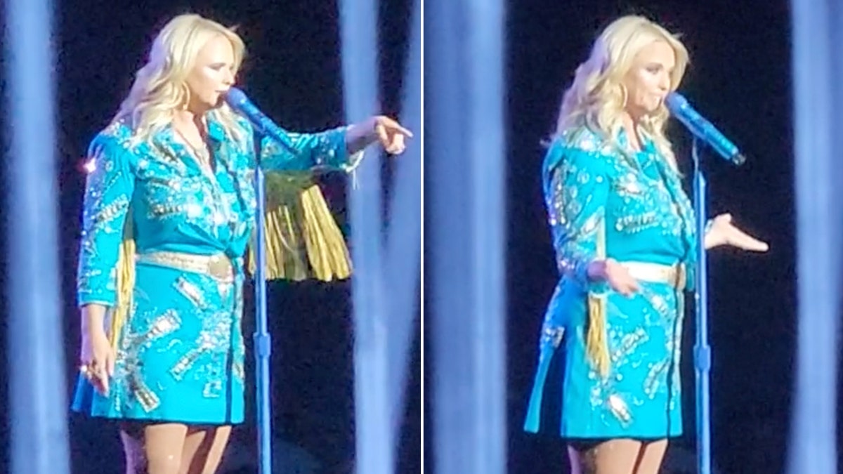 Miranda Lambert in a blue dress with fringe points to the crowd split Miranda Lambert puts her arms out on both sides with palms up