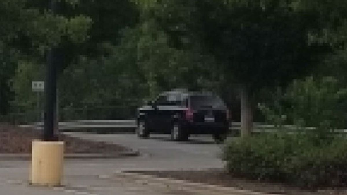 suspect SUV seen driving out of parking lot