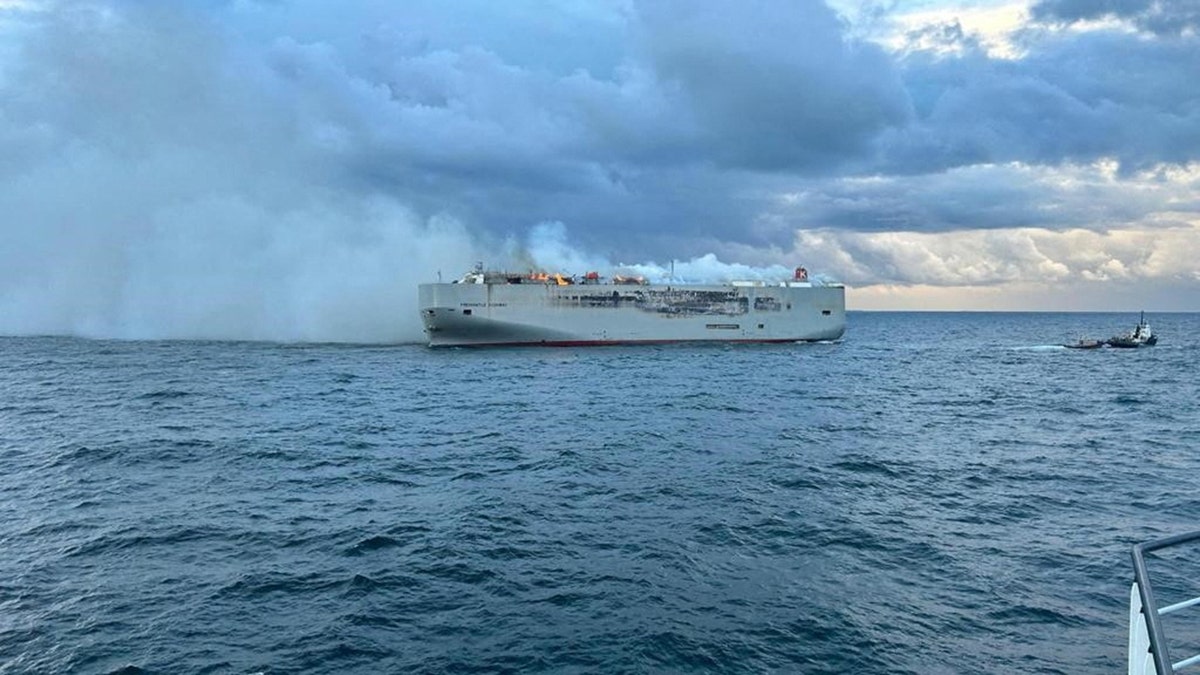 Smoke rises as a fire broke out on the cargo ship Fremantle Highway, at sea