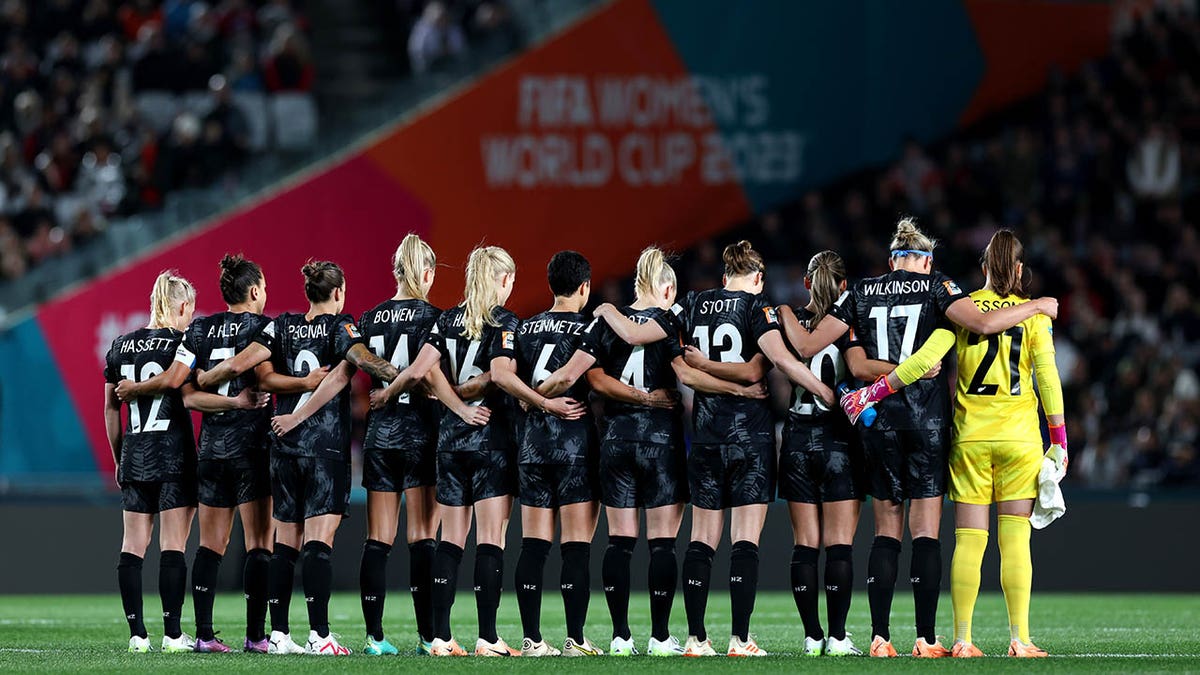 New Zealand players observe a moment of silence after Auckland shooting