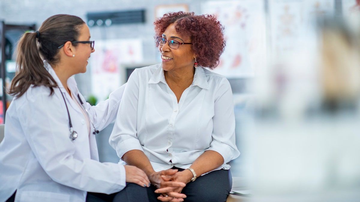 Older woman with doctor