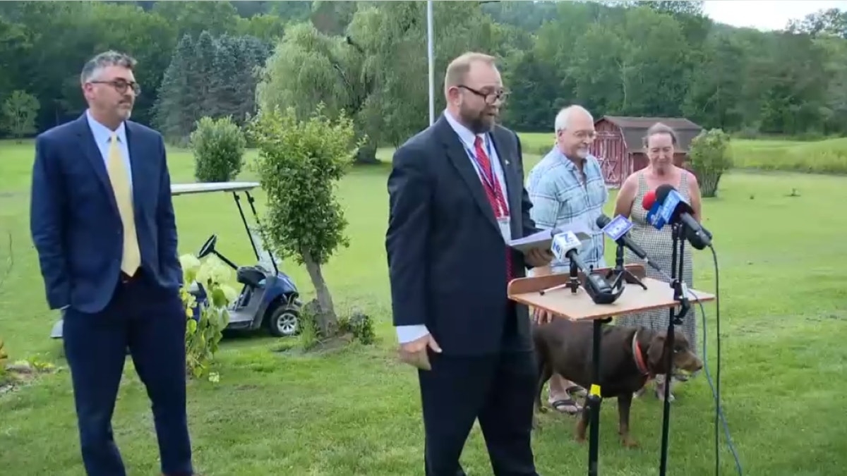 Ecklund couple and AG at presser