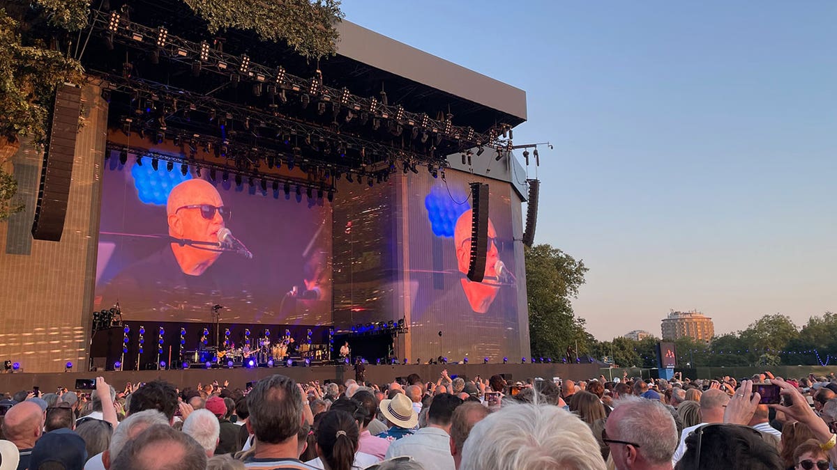 Billy Joel performs on piano on stage