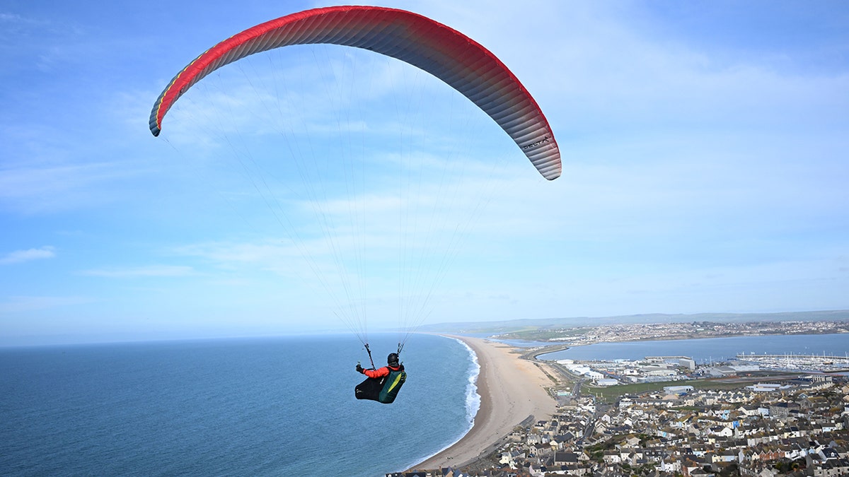 A person paragliding in England