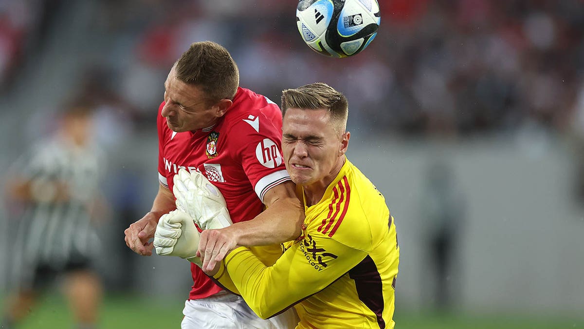 Paul Mullin collides with Nathan Bishop during a pre-season friendly