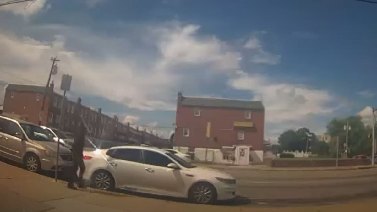Suspect entering white car