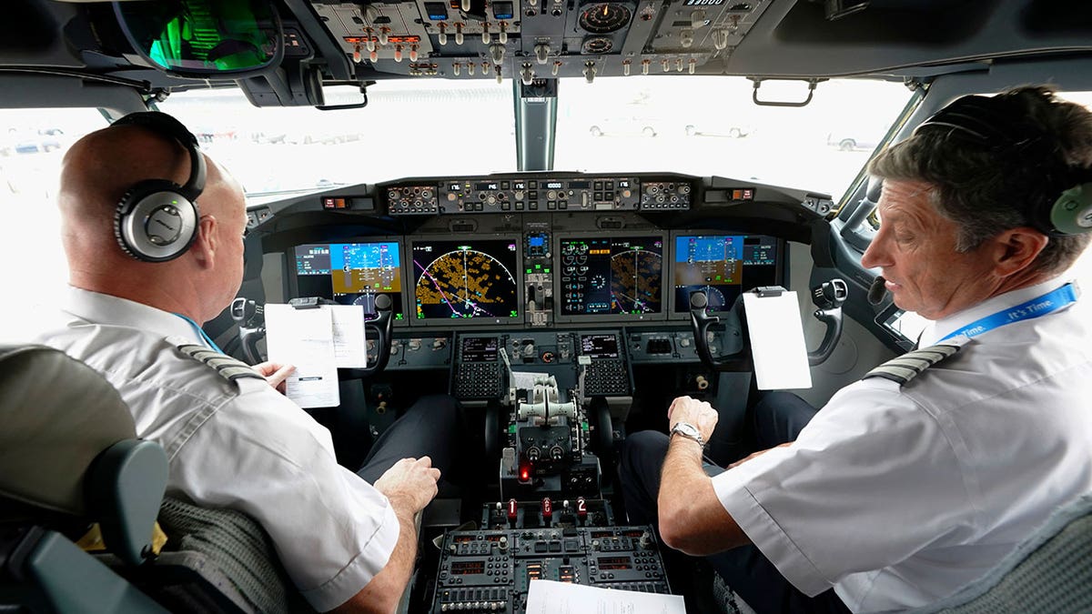 pilots in cockpit