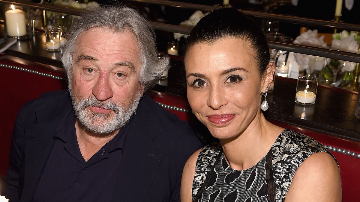 Actor Robert De Niro sits next to his daughter Drena