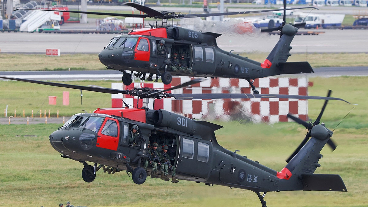 Blackhawk helicopters land at Taoyuan International Airport in Taiwan