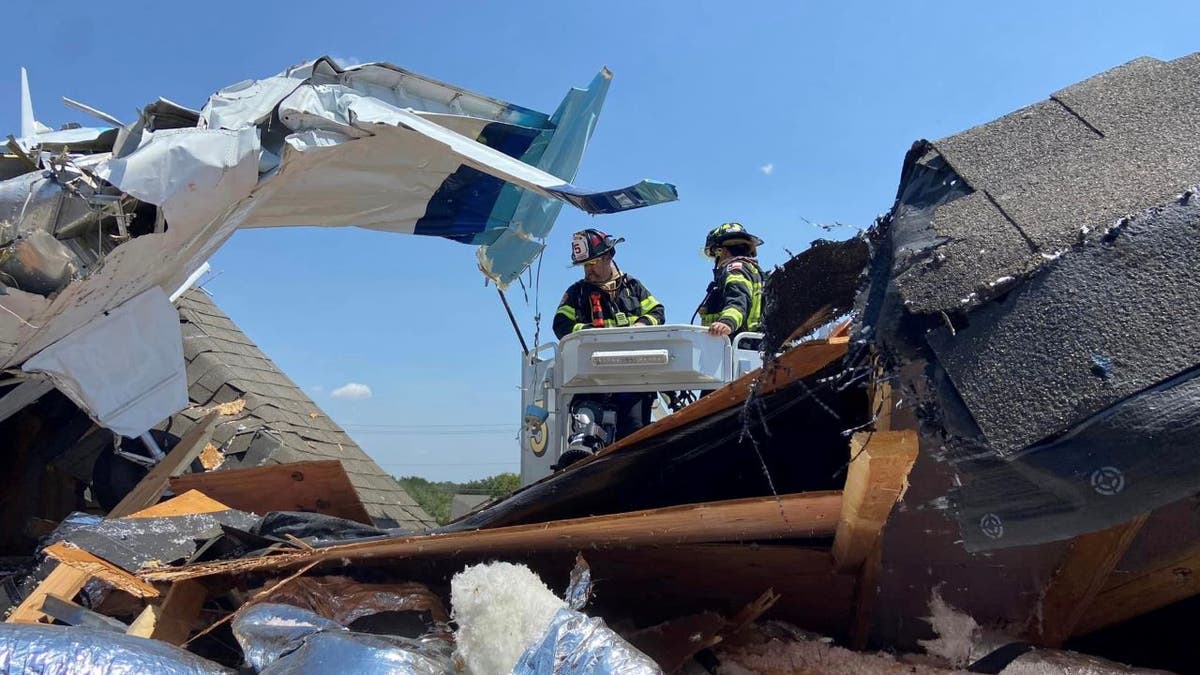 Firefighters at plane crash scene