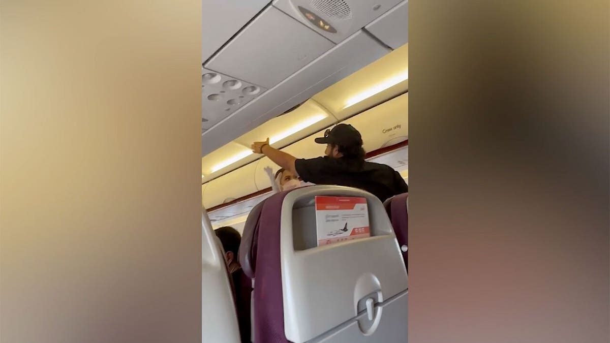Angry passenger with flight crew