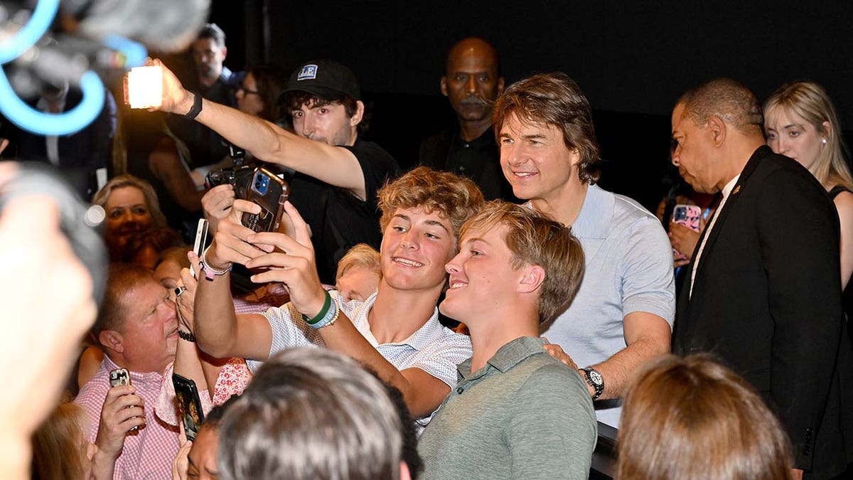 Tom Cruise taking photos with fans